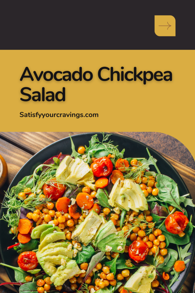 A vibrant Avocado Chickpea Salad with roasted chickpeas, sliced avocado, cherry tomatoes, and mixed greens, served on a black plate.