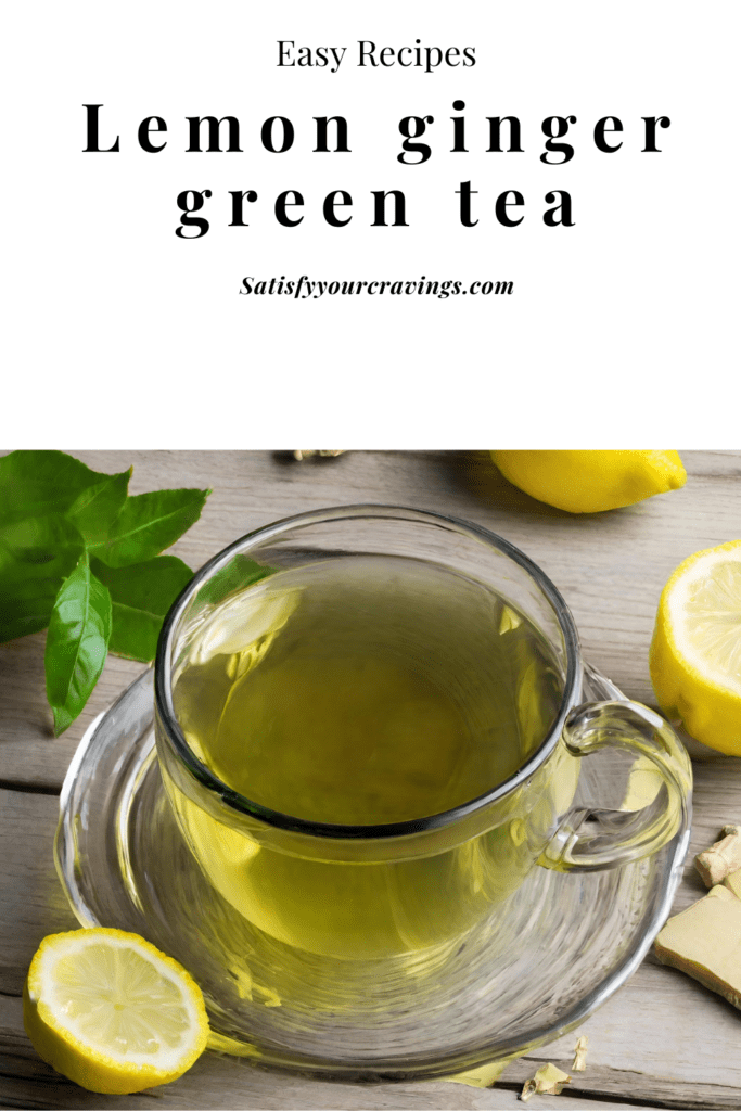 A steaming mug of lemon ginger green tea garnished with lemon slices and fresh mint leaves, on a rustic wooden table