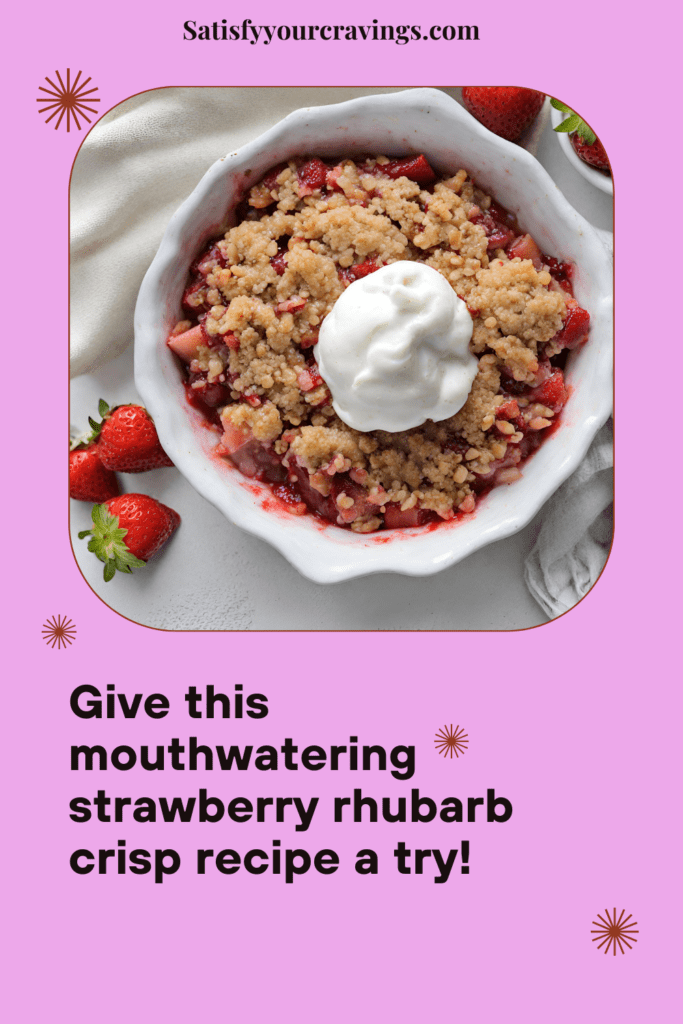 A close-up image of a freshly baked strawberry rhubarb crisp, showing the golden-brown crisp topping layered over the bubbling fruit filling in a white ceramic baking dish.