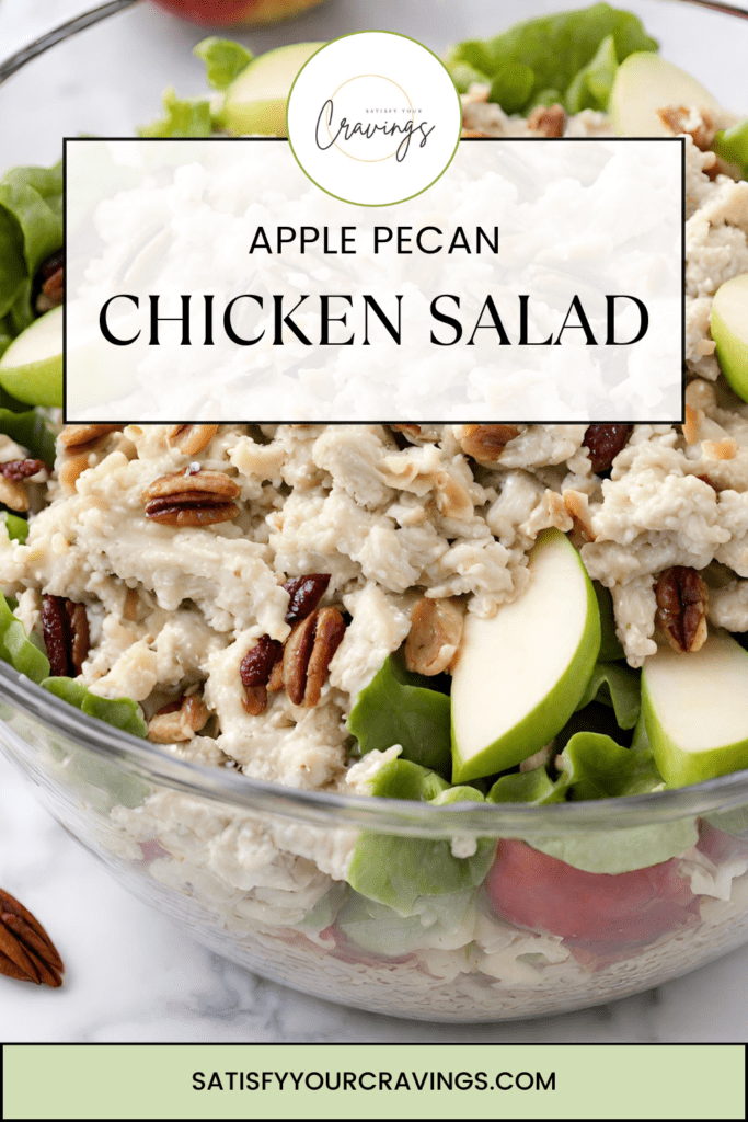 A fresh and appetizing bowl of Apple Pecan Chicken Salad, featuring succulent shredded chicken, crisp apple slices, and toasted pecans on a bed of lush green lettuce, garnished with dried cranberries for a hint of tart sweetness. Perfect for a healthy chicken salad recipe search.