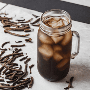 A mason jar filled with iced licorice root cold brew coffee sits on a white marble surface, surrounded by scattered, dried licorice roots. The cold brew has a deep, translucent brown hue, indicating a rich flavor, and is illuminated by natural light, highlighting the ice cubes and creating a refreshing visual appeal. The rustic appearance of the licorice roots complements the artisanal vibe of the beverage.