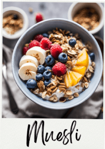 Delicious Muesli Breakfast Bowl topped with fresh bananas, raspberries, blueberries, and mango slices, sprinkled with almonds and pecans.