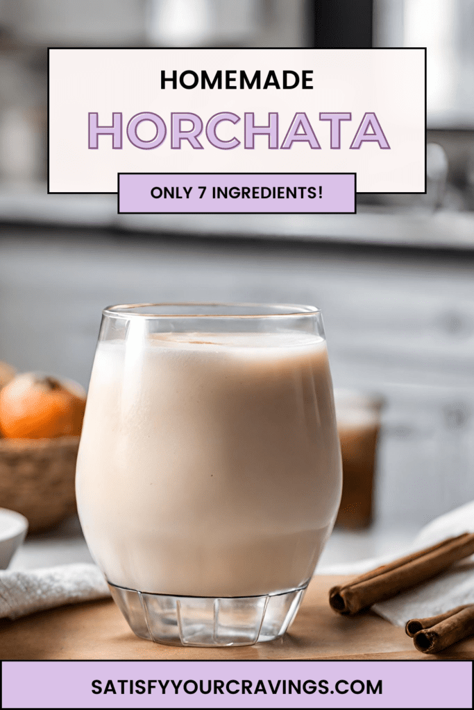 A glass of creamy homemade Horchata sits on a wooden cutting board, garnished with two cinnamon sticks. The background features a modern kitchen setting with natural light streaming in, highlighting a basket of fresh oranges and a white kitchen towel draped beside the glass.