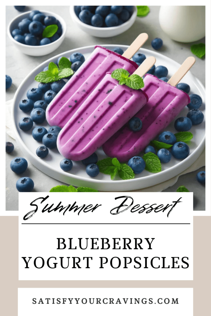 Plate of vibrant Blueberry Yogurt Popsicles surrounded by fresh blueberries and mint leaves, with the text "Summer Dessert" and "Blueberry Yogurt Popsicles" from SatisfyYourCravings.com, highlighting a healthy and refreshing summer treat.