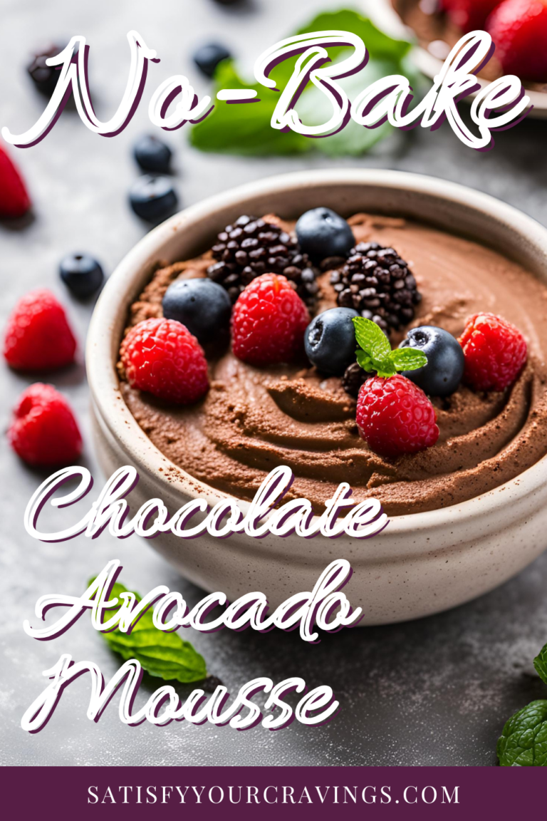 A bowl of no-bake chocolate avocado mousse topped with fresh raspberries, blueberries, and blackberries, garnished with mint leaves. The text overlay reads 'No-Bake Chocolate Avocado Mousse' with the website 'satisfyyourcravings.com' at the bottom.